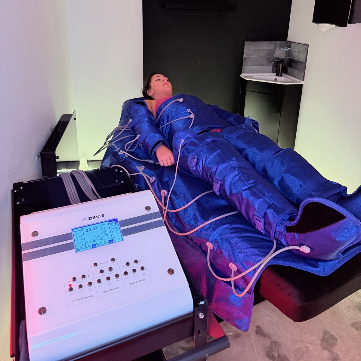 Patient in a pressotherapy suit during a session at Thriyv, a CQC clinic in Manchester